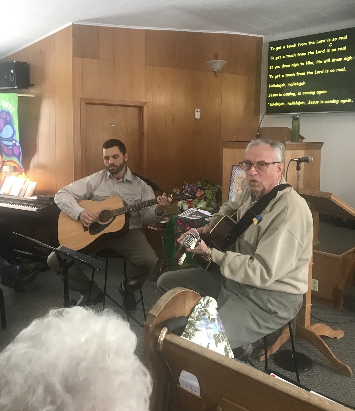 Jordan playing guitar with Pastor Mike Konoval